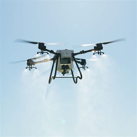 A Hylio ARES spray drone working a pasture